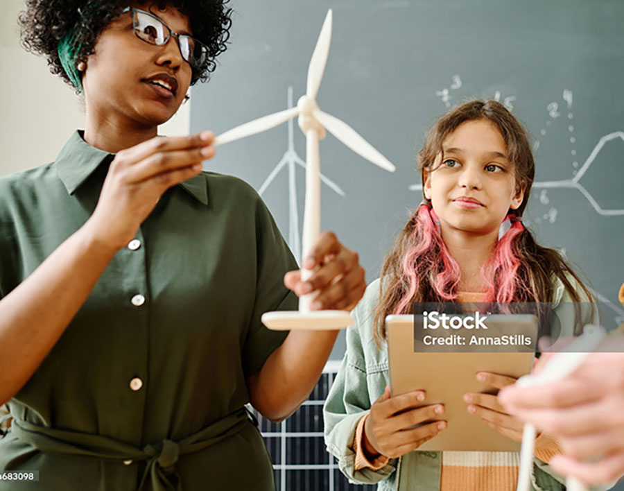 Teacher educating about windmills
