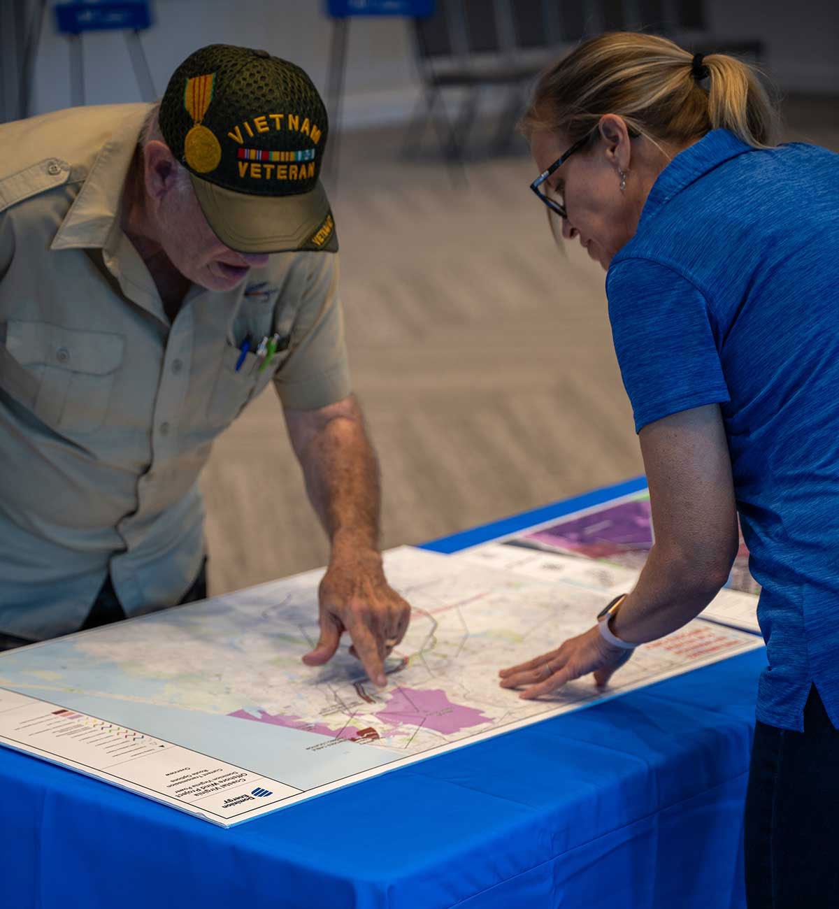 Community members looking at plans